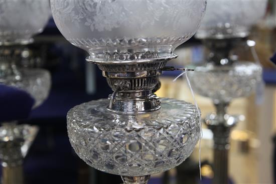 A late Victorian silver corinthian column oil lamp by Walker & Hall, overall height 87cm.
